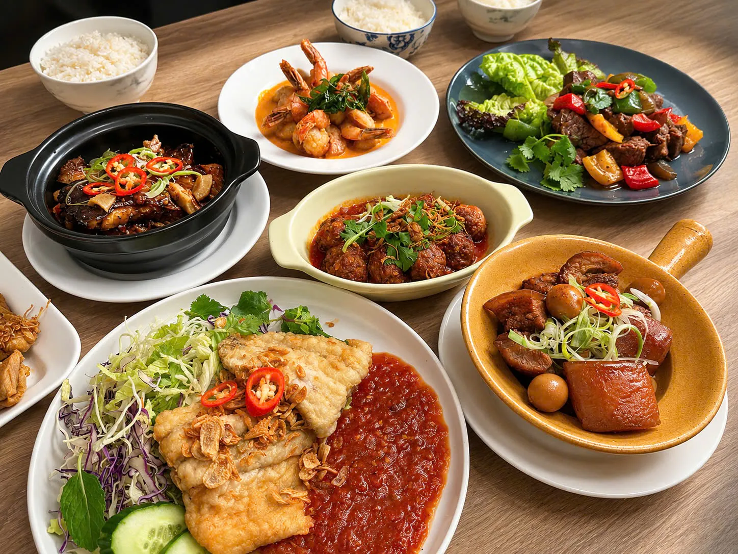 A generous table of Vietnamese dishes ready to be shared.