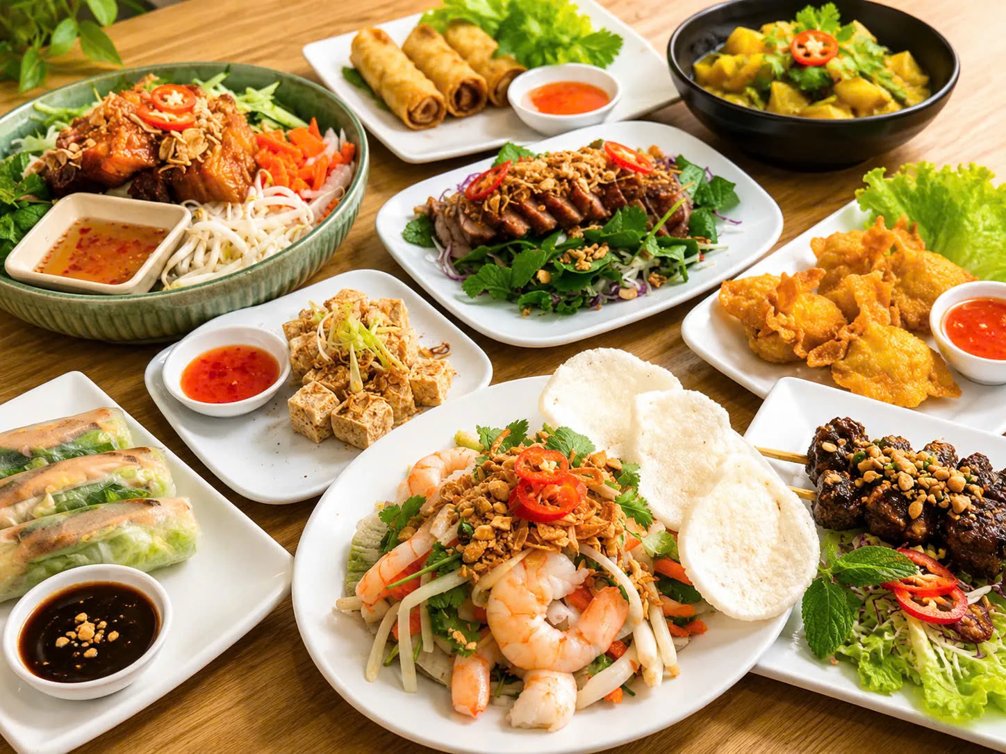 A shared table of Vietnamese dishes prepared by Uncle Tư’s Kitchen.
